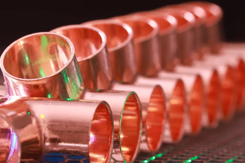 Rows of new copper pipe fittings